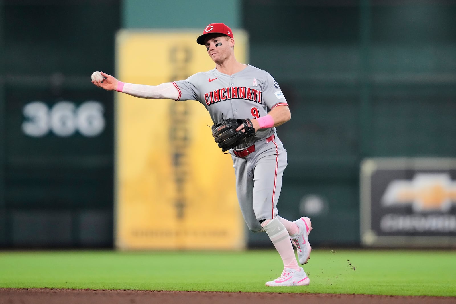 Cincinnati Reds second baseman Matt McLain throws to first to out Houston Astros' Jeremy Pena during the seventh inning of a baseball game in Houston, Sunday, May 11, 2025. (AP Photo/Ashley Landis)
