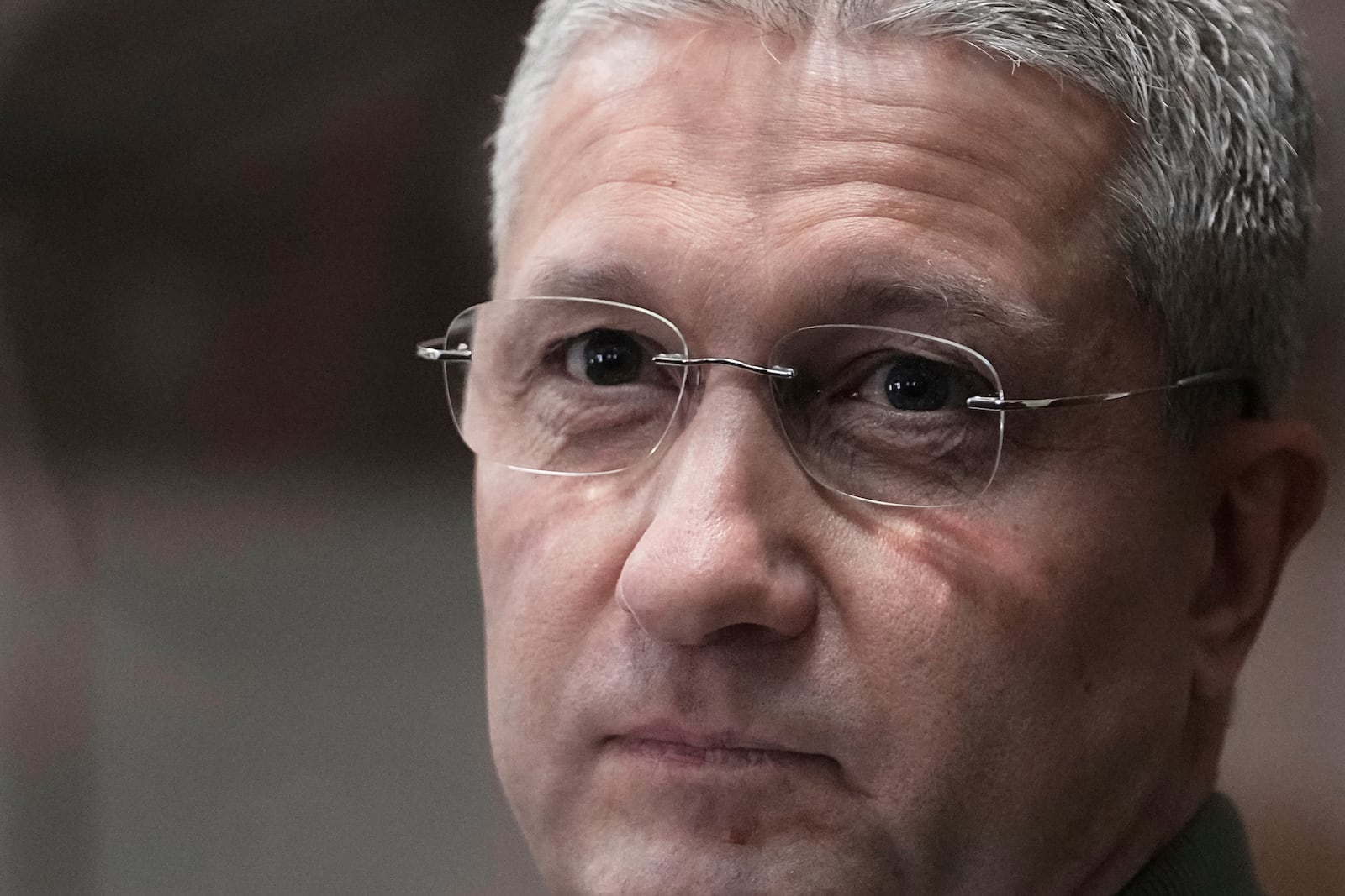 FILE - Timur Ivanov, Russia's former deputy defense minister facing corruption charges, stands in the defendant's cage before a hearing, in the Moscow City Court in Moscow, Russia, on Monday, March 24, 2025. (AP Photo/Pavel Bednyakov, File)