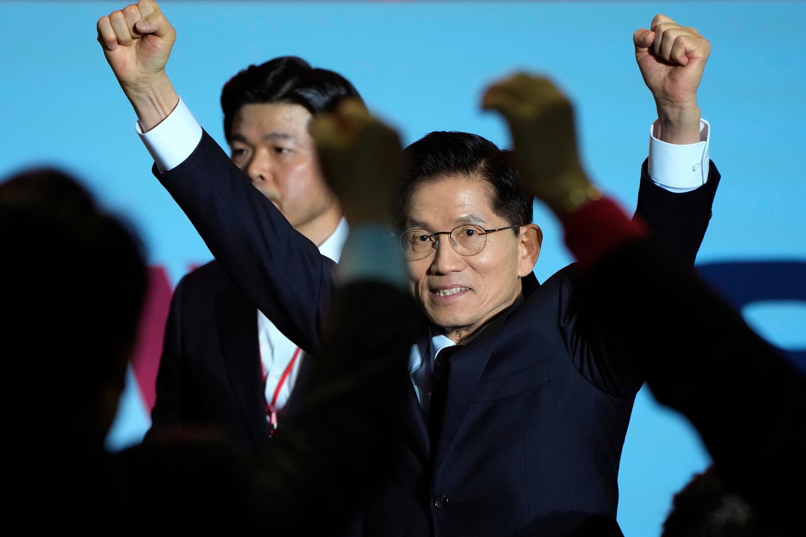 South Korea's former Labor Minister Kim Moon Soo is greeted by supporters as he arrives to attend the People Power Party's convention in Goyang, South Korea, Saturday, May 3, 2025. (AP Photo/Ahn Young-joon)