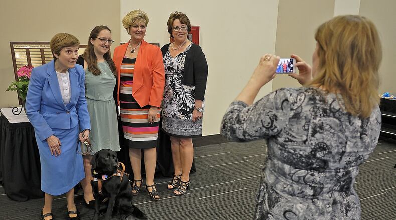 The winners of this year’s Extraordinary Women of Clark County award, from left, Debra Baker, Kali Lawrence, Shelley Lopez and Daragh Porter-Wobbe pose for a picture after the awards luncheon Tuesday. Bill Lackey/Staff
