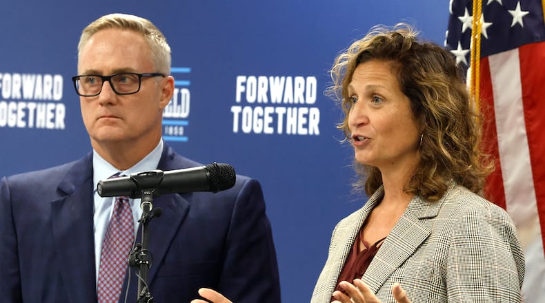 Clark County Commissioner Melanie Flax Wilt and Springfield Mayor Rob Rue talk about the false rumors spreading about the Haitian community in Springfield. BILL LACKEY/STAFF