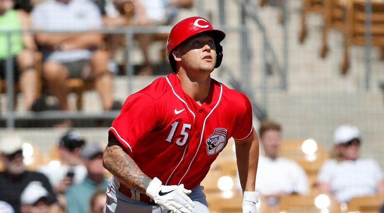 Cincinnati Reds’ Nick Senzel (15) watches his home run during a spring training baseball game against the Chicago White Sox, Monday, March 9, 2020, in Glendale, Ariz. (AP Photo/Sue Ogrocki)