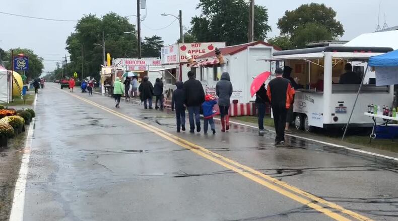 Residents wait in line for food at the South Vienna Sweet Corn Festival.