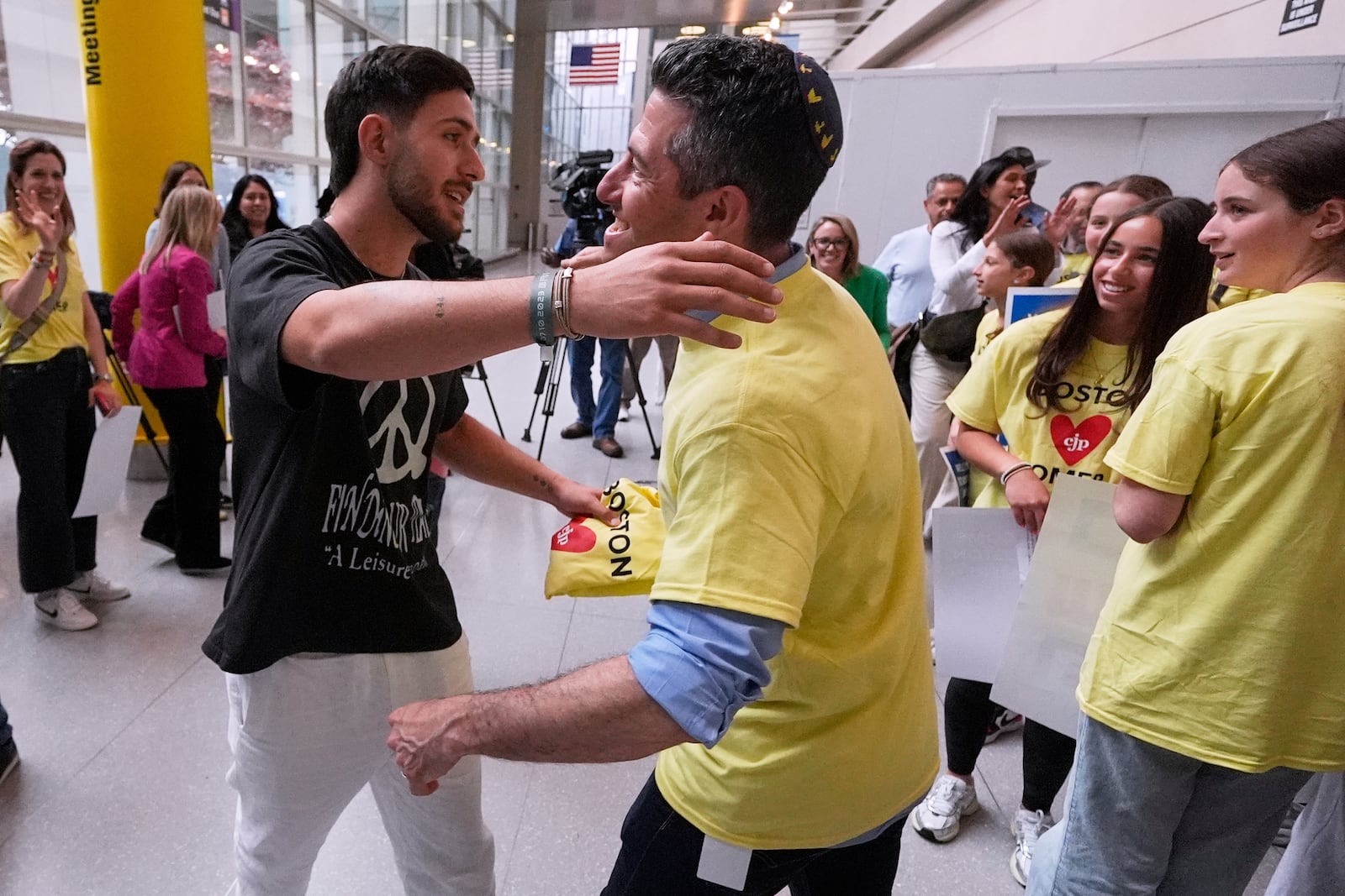 Omer Shem Tov, an Israeli hostage who survived over 500 days in Hamas captivity, is welcomed during his arrival at Logan Airport, Thursday, May 15, 2025, in Boston. (AP Photo/Charles Krupa)