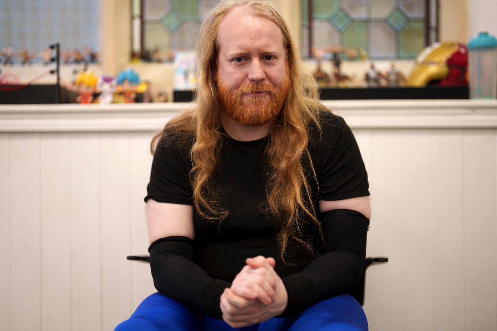 Wrestler Liam Ledger aka Daemon Crowe sits backstage at St Peter's Church in Shipley before one of the Kingdom Wrestling's monthly shows, Saturday, March 29, 2025. (AP Photo/Jon Super)
