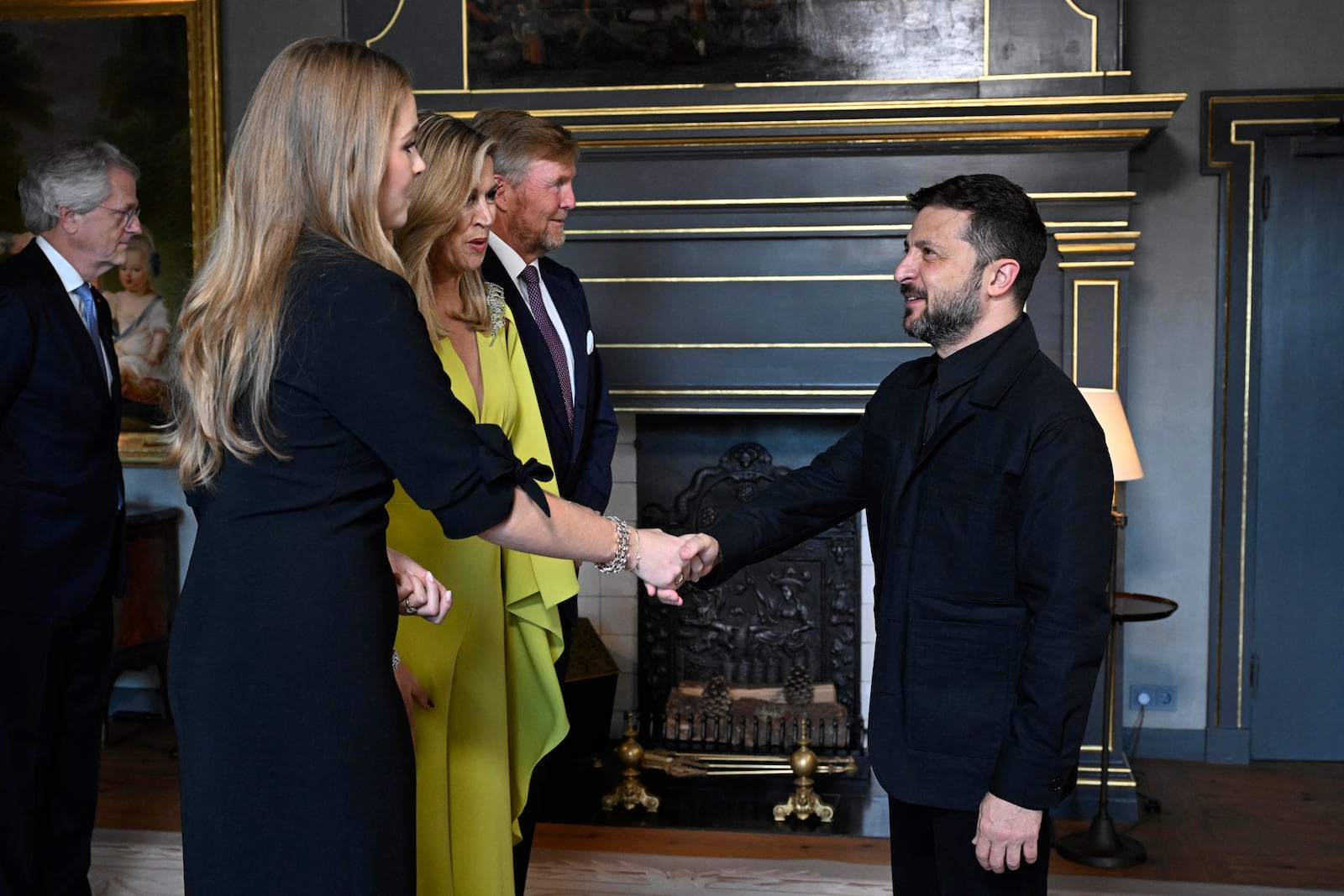 Ukraine's President Volodymyr Zelenskyy, right, is welcomed by Netherland's King Willem Alexander and Netherland's Queen Maxima as he arrives for a formal dinner at the Paleis Huis ten Bosch ahead of the NATO summit in The Hague, Netherlands, Tuesday, June 24, 2025. (Misha Schoemakers, Pool Photo via AP)