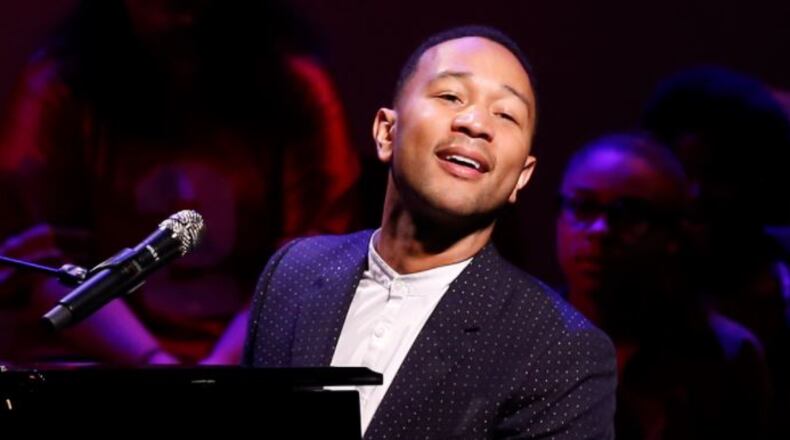 John Legend performs on stage during a concert following the ribbon cutting for the new John Legend Theater in Springfield. Bill Lackey/Staff