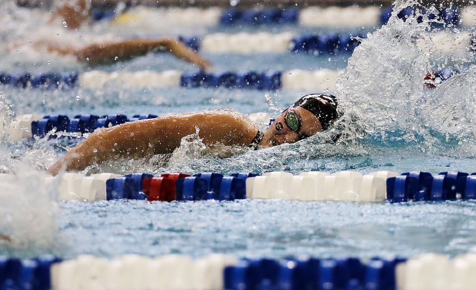 FILE - Georgia's Olivia Smoliga swims to a first-place finish in the 100-yard freestyle at the NCAA women's swimming and diving championships at Georgia Tech, March 19, 2016, in Atlanta. (AP Photo/David Goldman, File)