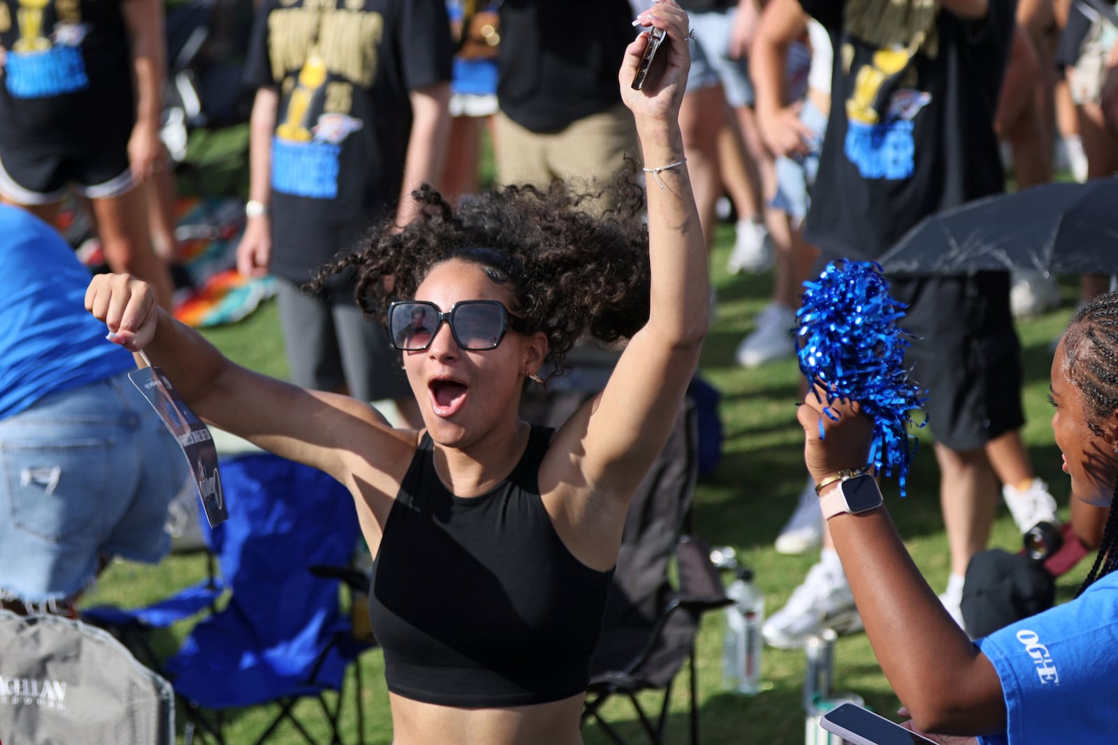 A fan cheers during a celebration of the Oklahoma City Thunder's NBA basketball championship Tuesday, June 24, 2025, in Oklahoma City. (AP Photo/Nate Billings)