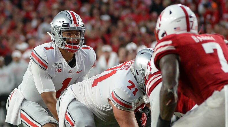 LINCOLN, NE - SEPTEMBER 28: Quarterback Justin Fields #1 of the Ohio State Buckeyes looks over the line during the game against the Nebraska Cornhuskers at Memorial Stadium on September 28, 2019 in Lincoln, Nebraska. (Photo by Steven Branscombe/Getty Images)