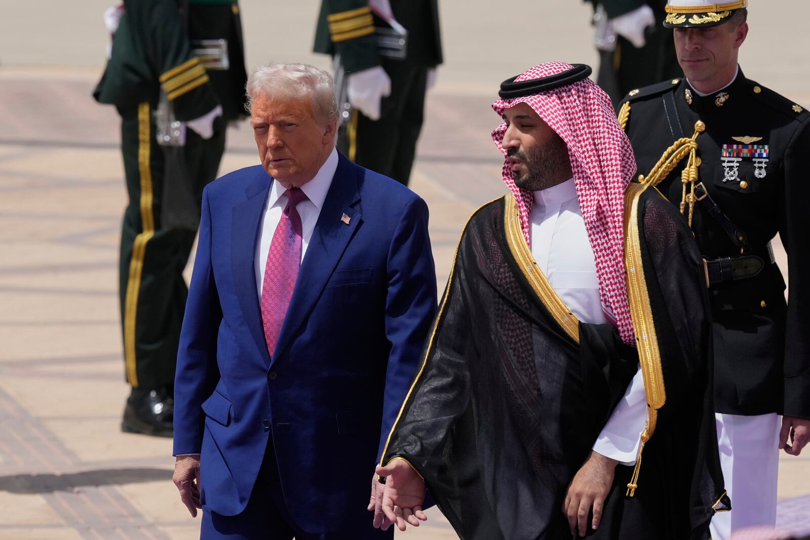 President Donald Trump speaks with Saudi Crown Prince Mohammed bin Salman during an arrival ceremony at the Royal Terminal of King Khalid International Airport in Riyadh, Saudi Arabia, Tuesday, May 13, 2025
