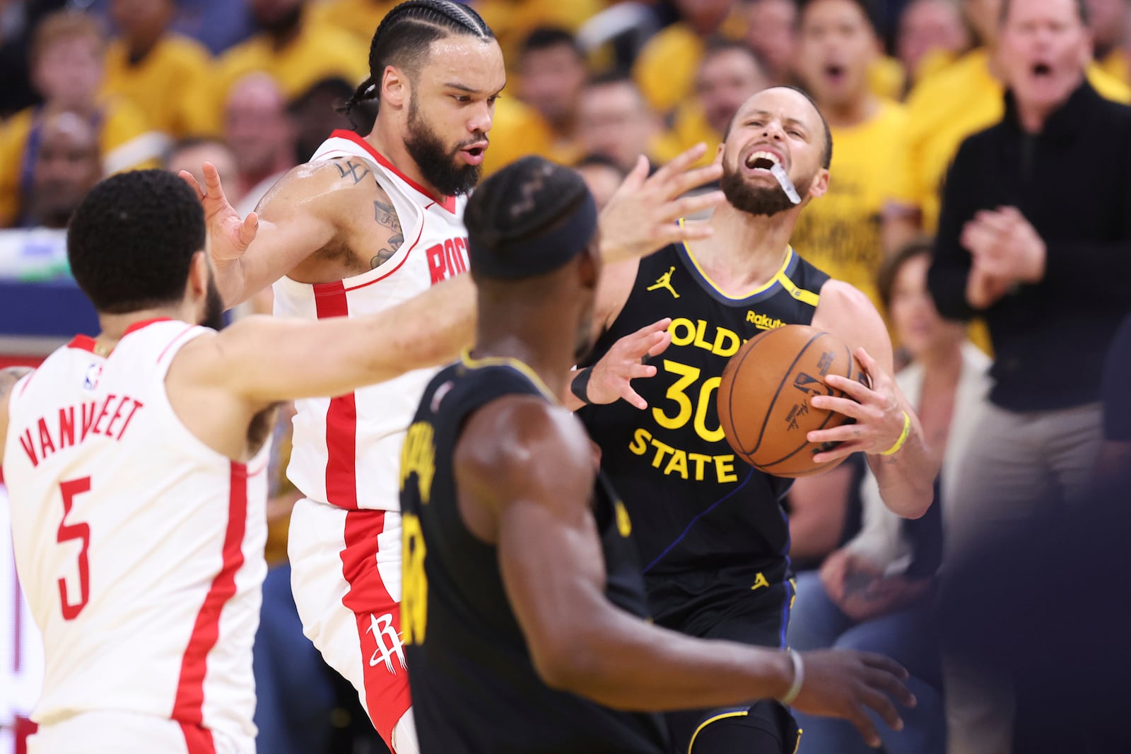 Golden State Warriors' Stephen Curry is fouled by Houston Rockets' Dillon Brooks before making a basket in second quarter of Game 6 of an NBA basketball first-round playoff series Friday, May 2, 2025, in San Francisco. (Scott Strazzante/San Francisco Chronicle via AP)