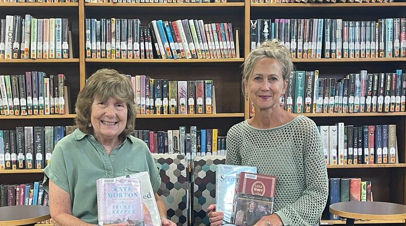 Cutline: Librarians Pam Dittner (left) and  Chris Williams facilitate The Rowdy Readers book club at Brown Memorial Library. CONTRIBUTED