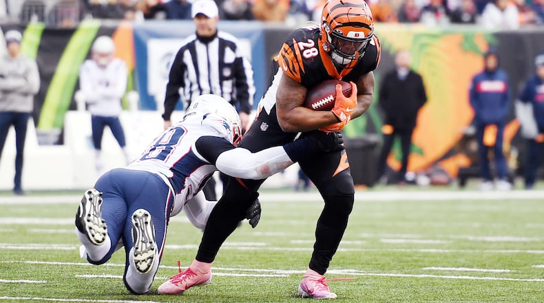 CINCINNATI, OHIO - DECEMBER 15: Joe Mixon #28 of the Cincinnati Bengals carries the ball during the first half against the New England Patriots in the game at Paul Brown Stadium on December 15, 2019 in Cincinnati, Ohio. (Photo by Bobby Ellis/Getty Images)