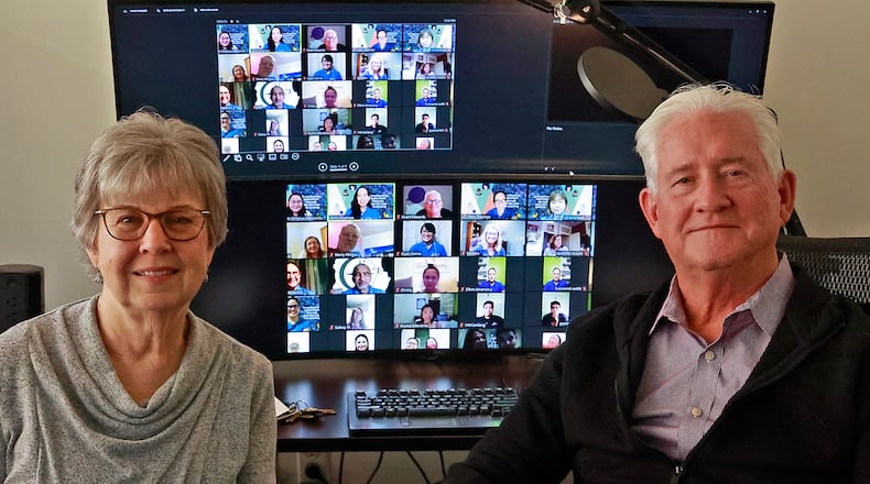 Ellen Dudney and Grant Edwards, from Discipling Another, with some of the people the group works with around the world. BILL LACKEY/STAFF