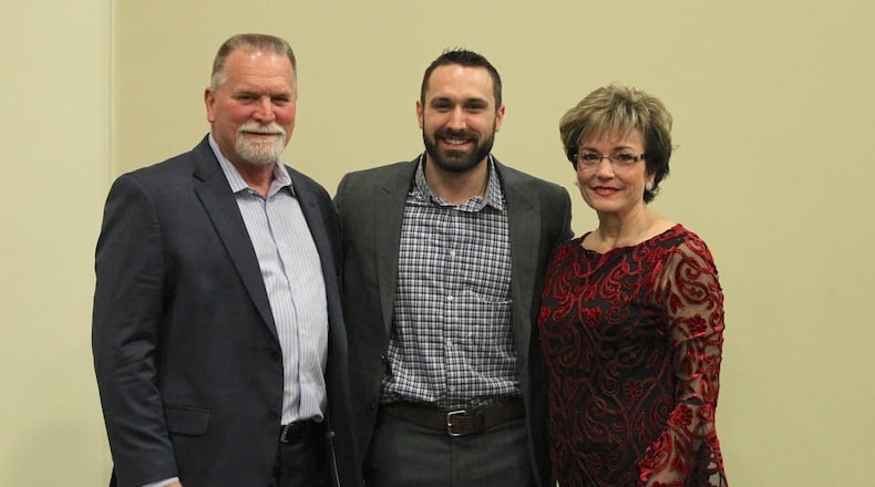 Adam Eaton stands with his parents, Glenn, left, and Robin, right, at the Springfield/Clark County Baseball Hall of Fame banquet in 2018 in Springfield. David Jablonski/Staff