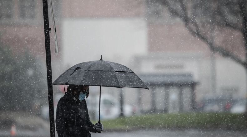 Snow comes down on East Stewart St. near the University of Dayton Monday Nov. 30.