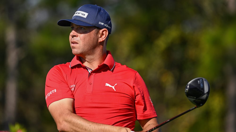 FILE - Gary Woodland looks on after hitting his tee shot on the second hole during the final round of the PNC Championship golf tournament, Dec. 21, 2025, in Orlando, Fla. (AP Photo/Phelan M. Ebenhack, File)