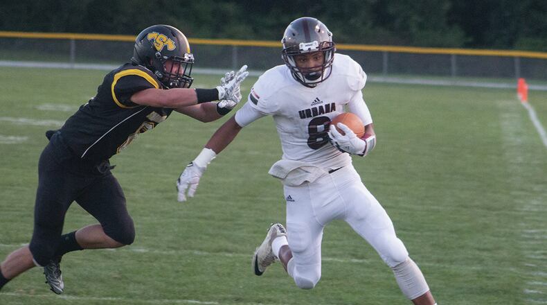 Urbana receiver Marion Krebehenne is chased toward the sideline by Shawnee defensive back Aaron Schack deep in Shawnee territory Friday night. Jeff Gilbert/CONTRIBUTED