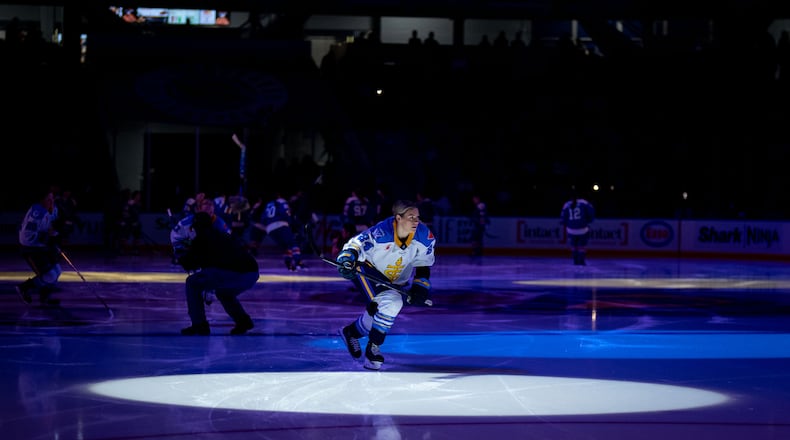 Toronto Sceptres' Natalie Spooner, center, enters the ice before a PWHL hockey game against the Vancouver Goldeneyes in Vancouver, British Columbia, Thursday, Jan. 22, 2026. (Ethan Cairns/The Canadian Press via AP)