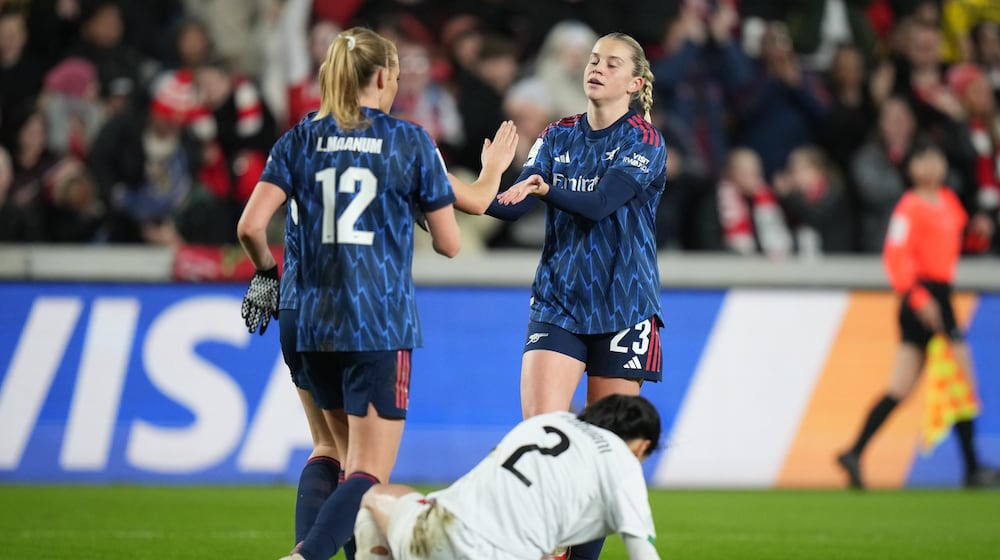 Arsenal's Alessia Russo, right, celebrates after scoring her side's fifth goal during the Women's Champions Cup semifinal soccer match between Arsenal and Asfar in London, Wednesday, Jan. 28, 2026. (AP Photo/Alastair Grant)