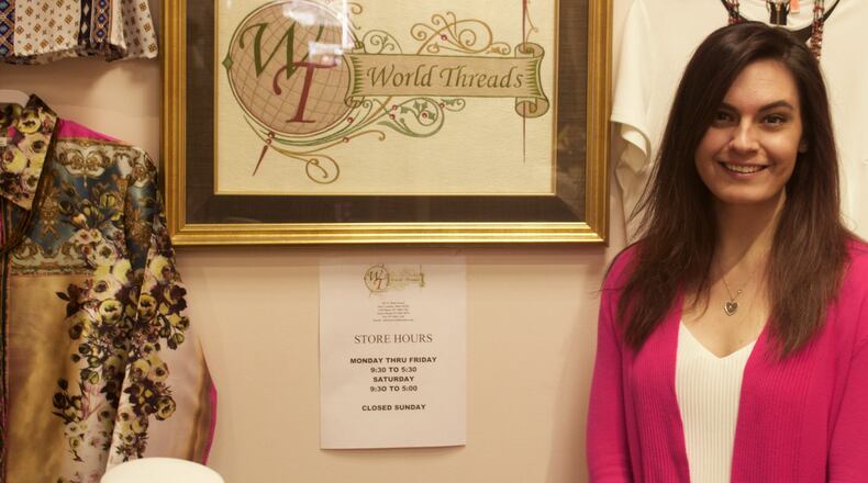 Owner Sarah Trimbach shows off merchandise at World Thread in New Carlisle on Tuesday, Feb. 14, 2017. Hasan Karim/Staff