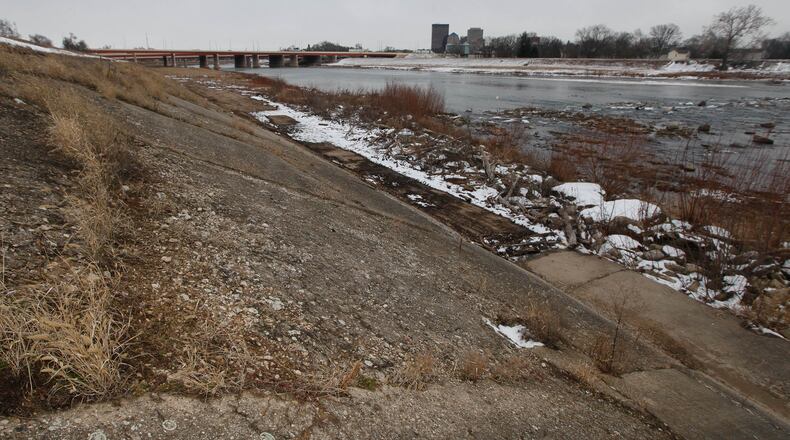 Deteriorated concrete on the Greater Old North Dayton levee will be replaced in three locations, including here across from Kettering Field, primarily through a $1.1 million federal grant. CHRIS STEWART / STAFF