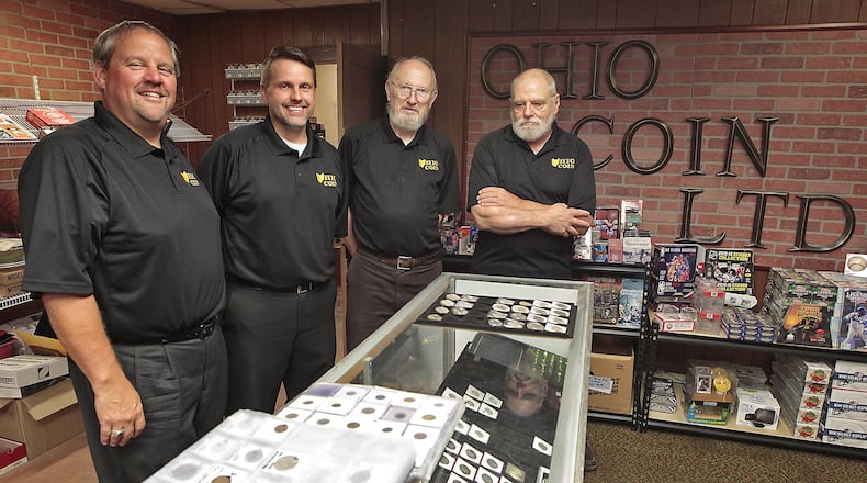 The guys at Ohio Coin LTD, from left, Steve Stuckey, Bruce Smith, Loren Rittenhouse and Bill Kilgore are trying to boost its recognition with a new website and other changes. Bill Lackey/Staff