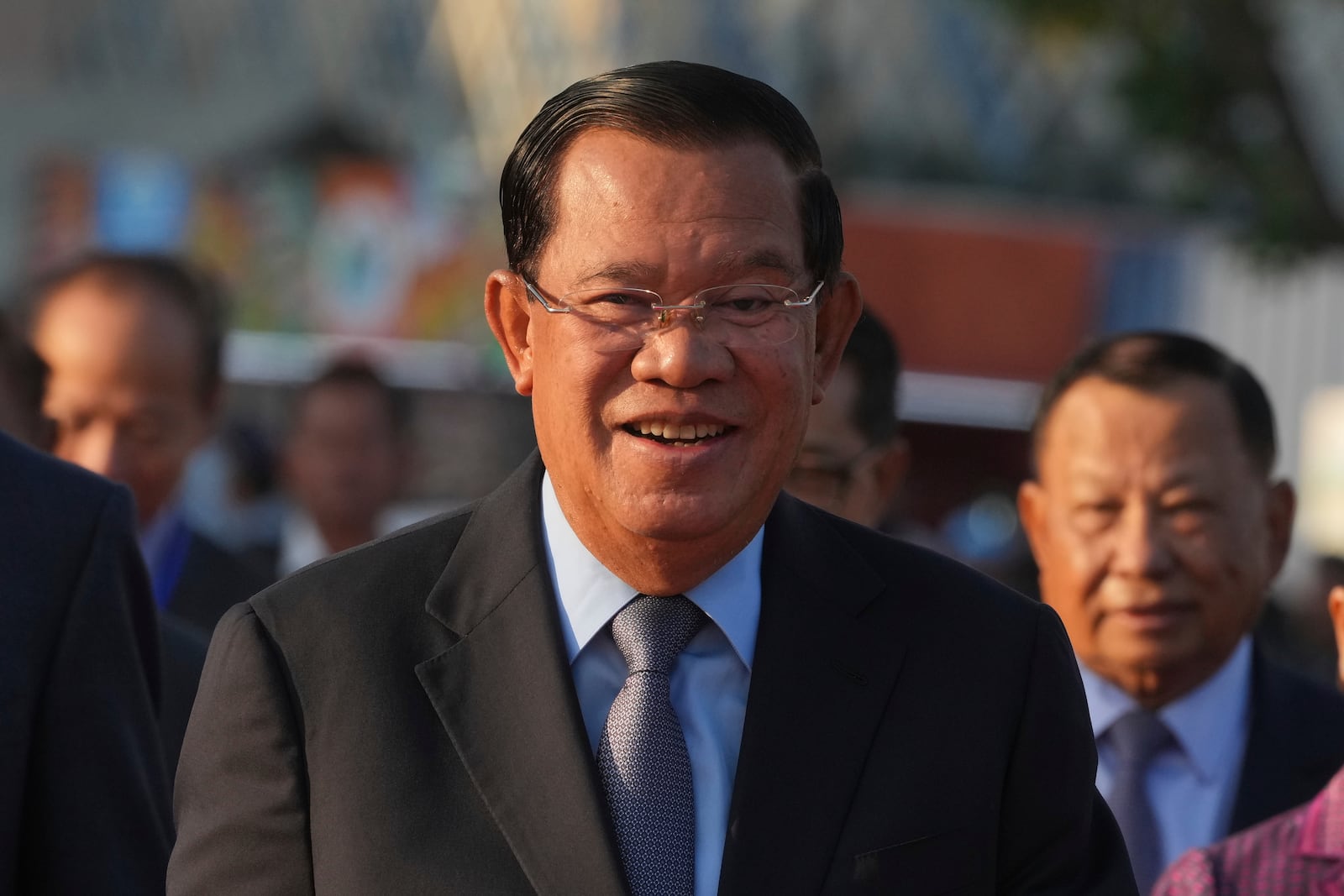 FILE - Cambodian President of the Senate Hun Sen smiles as he arrives at Victory Day to mark the 46th ouster anniversary of the Khmer Rouge regime that ruled Cambodia from 1975 to 1979, in Phnom Penh, Cambodia, , Jan. 7, 2025. (AP Photo/Heng Sinith, File)