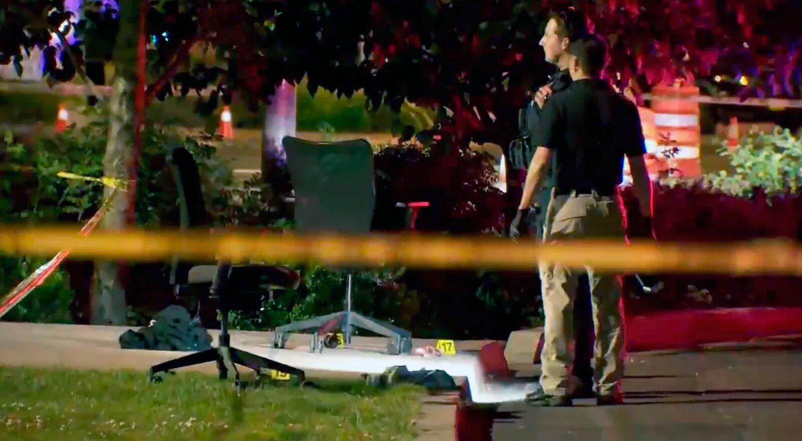 This image taken from video provided by KATU-TV shows police investigating a stabbing at a shelter in Salem, Ore., June 1, 2025. (KATU-TV via AP)