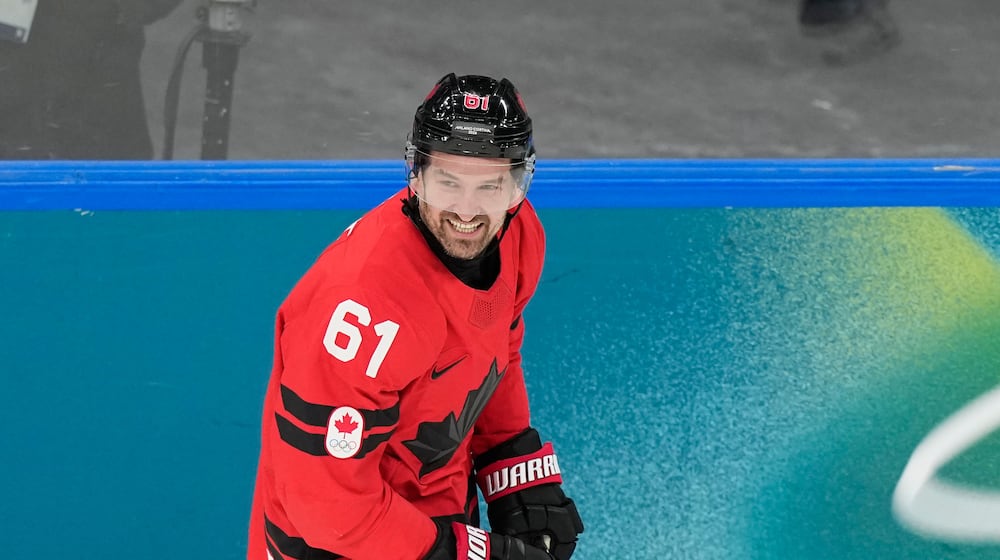 Canada's Mark Stone (61) celebrates after scoring a goal during a preliminary round game of men's ice hockey between Canada and France at the 2026 Winter Olympics, in Milan, Italy, Sunday, Feb. 15, 2026. (AP Photo/Hassan Ammar)