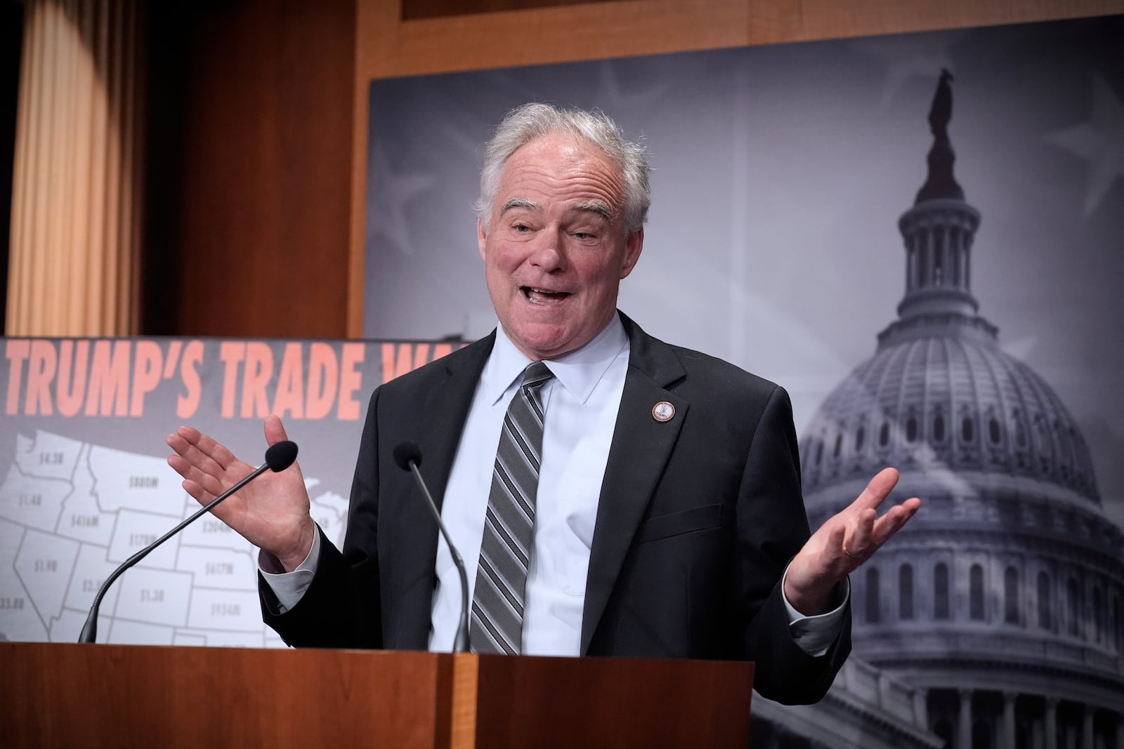 Sen. Tim Kaine, D-Va., and other Democrats speak to reporters about President Donald Trump's tariffs on foreign countries, at the Capitol, in Washington, Wednesday, April 2, 2025. (AP Photo/J. Scott Applewhite)