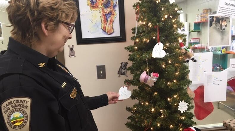 Clark County Dog Warden Sandi Click looks at the name of the dogs that need sponsored at the Clark County Dog Shelter. People can sponsor the cost of a dog’s spay or neuter to lower the adoption cost for someone who is ready to bring one home. JENNA LAWSON/STAFF.