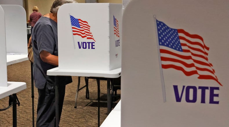A voter fills out her ballot at the election poll in the First Christian Church in Springfield Tuesday, August 8, 2023. BILL LACKEY/STAFF