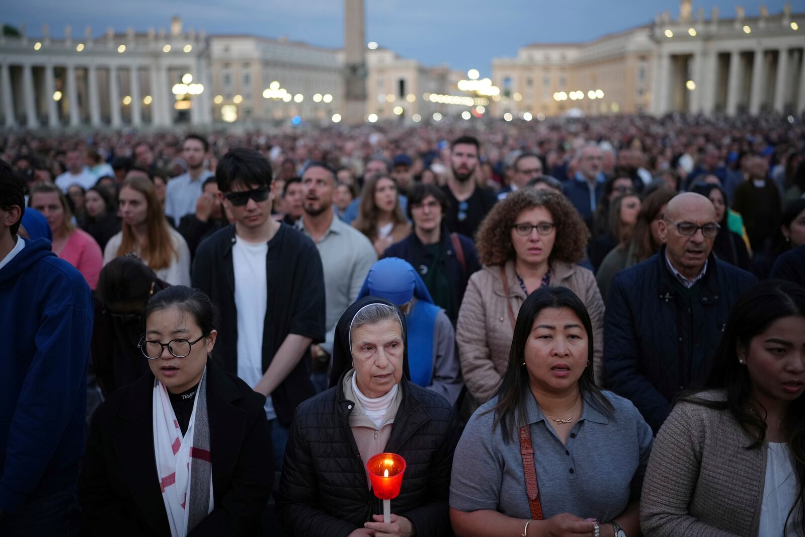 Faithful gather for a rosary prayer for the late Pope Francis, in St. Peter's Square at the Vatican, Monday April 21, 2025 (AP Photo/Alessandra Tarantino)