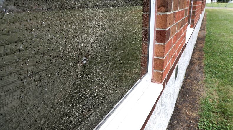 Six windows along the back of Lincoln Elementary are shattered after being shot out earlier this week. BILL LACKEY/STAFF