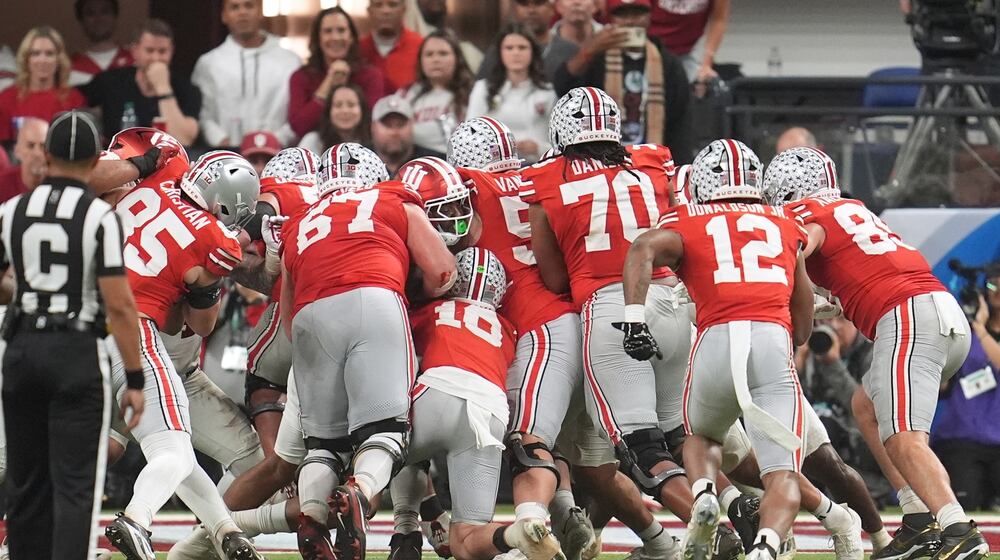 Ohio State's Julian Sayin is stopped on a fourth down run during the second half of the Big Ten championship NCAA college football game against Indiana in Indianapolis, Saturday, Dec. 6, 2025. (AP Photo/Michael Conroy)
