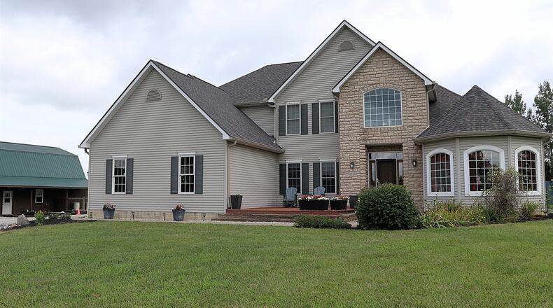 Listed for $774,898 by Berkshire Hathaway Home Professional Services, the vinyl-sided home at 1150 Roxanne New Burlington Road has about 3,724 square feet of living space plus a finished basement with walkout access. KATHY TYLER/CONTRIBUTED