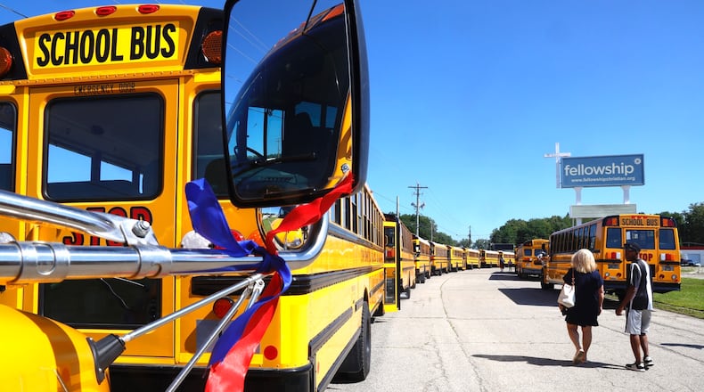 The Fellowship Christian Church was surrounded by 37 school buses Monday, August 28, 2023 during the funeral for 11-year-old Aiden Clark, who was killed in a Northwestern school bus crash. BILL LACKEY/STAFF