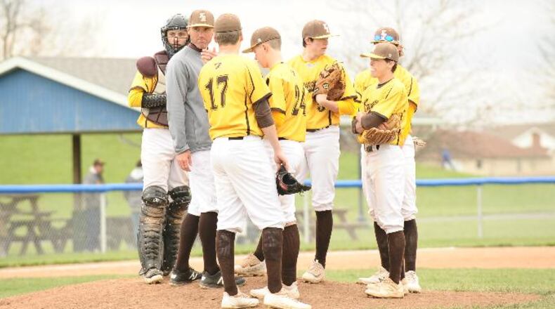 Kenton Ridge coach Aaron Shaffer (grey shirt) talks with his Cougars during a 12-6 win against Russia on Saturday. Greg Billing / Contributed