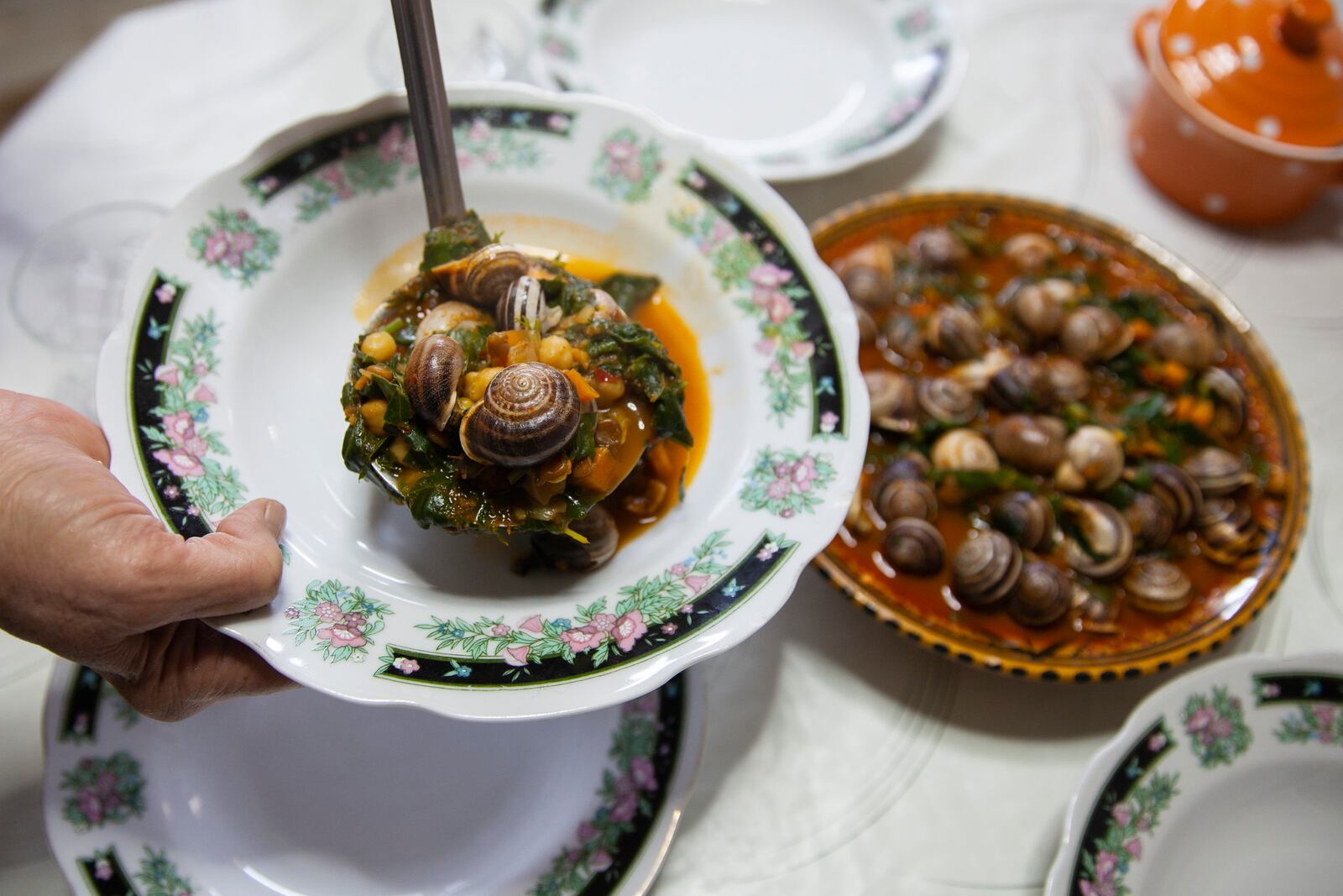 Snails are served in a stew for a family to break their Ramadan fast, in Sfax, Tunisia, March 29, 2025. (AP Photo/Ons Abid)