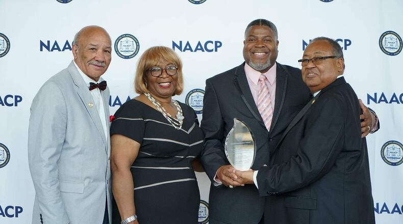 The Dayton Unit NAACP received the national organization’s top honor, the Thalheimer Award, in July. Pictured (from left) are Tom Roberts, Ohio Conference NAACP state president, Gloria Sweetlove, NAACP’s chair of memberships and units committee, Dayton Unit President Derrick Foward, and Leon W. Russell, chairman of the NAACP board of directors. CONTRIBUTED