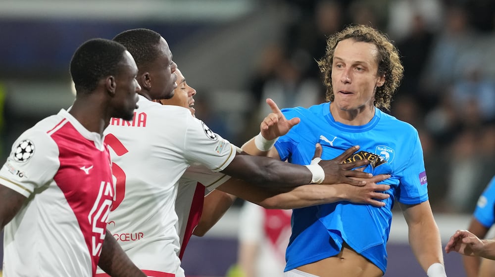 Monaco's Denis Zakaria, second left, argues with Pafos' David Luiz, right, during the Champions League opening phase soccer match between Pafos FC and AS Monaco in Limassol, Cyprus, Wednesday, Nov. 26, 2025. (AP Photo/Petros Karadjias)