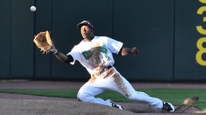 Taylor Trammell catches a foul ball near the Dayton bullpen on the left-field line during the third inning of a game against South Bend on Saturday night at Fifth Third Field. BRYANT BILLING / CONTRIBUTED