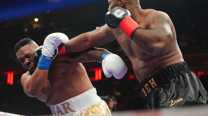 Kingsley Ibeh, right, punches Jarrell Miller during a heavyweight boxing match Saturday, Jan. 31, 2026, in New York. (AP Photo/Frank Franklin II)