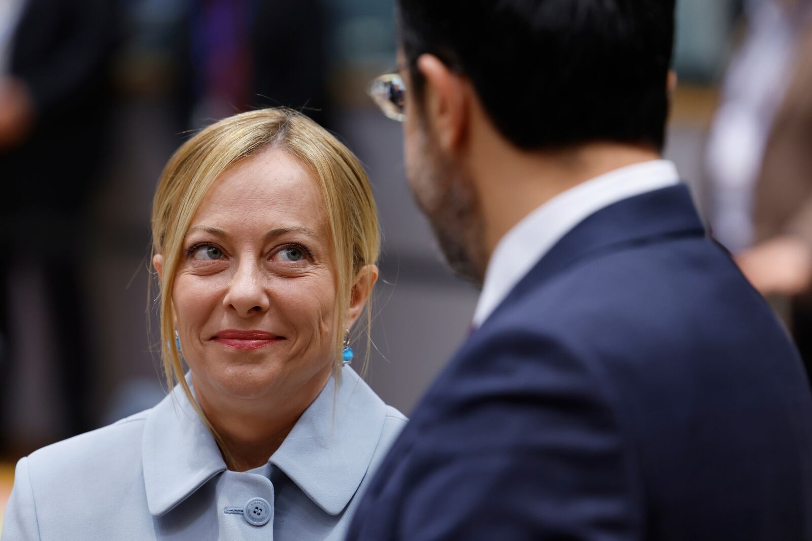 Italy's Prime Minister Giorgia Meloni, left, speaks with Cypriot President Nikos Christodoulides during a round table meeting at an EU summit in Brussels, Thursday, June 26, 2025. (AP Photo/Geert Vanden Wijngaert)
