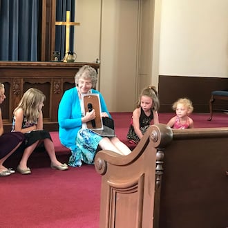 A woman leads a children's service at New Carlisle’s Honey Creek Presbyterian Church, 212 Jefferson St., which will have its final service and a special celebration of its 221 years of service beginning at 3:30 p.m. Sunday, Nov. 30. CONTRIBUTED