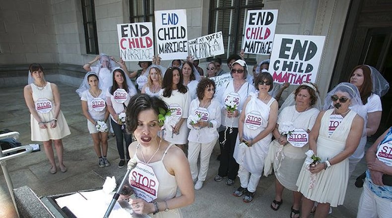 Fraidy Reiss, director of the nonprofit group Unchained At Last speaks at a protest June 1 of New Jersey Gov. Chris Christie’s veto of a bill that would have prevented the marriage of any female under 18. Protesters wore veils and put tape over their mouths in opposition to the veto. (Photo by Michael Mancuso, NJ.com).