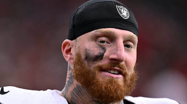 FILE - Las Vegas Raiders defensive end Maxx Crosby (98) looks on during the first half of an NFL football game against the Houston Texans, Dec. 21, 2025, in Houston. (AP Photo/Maria Lysaker, File)
