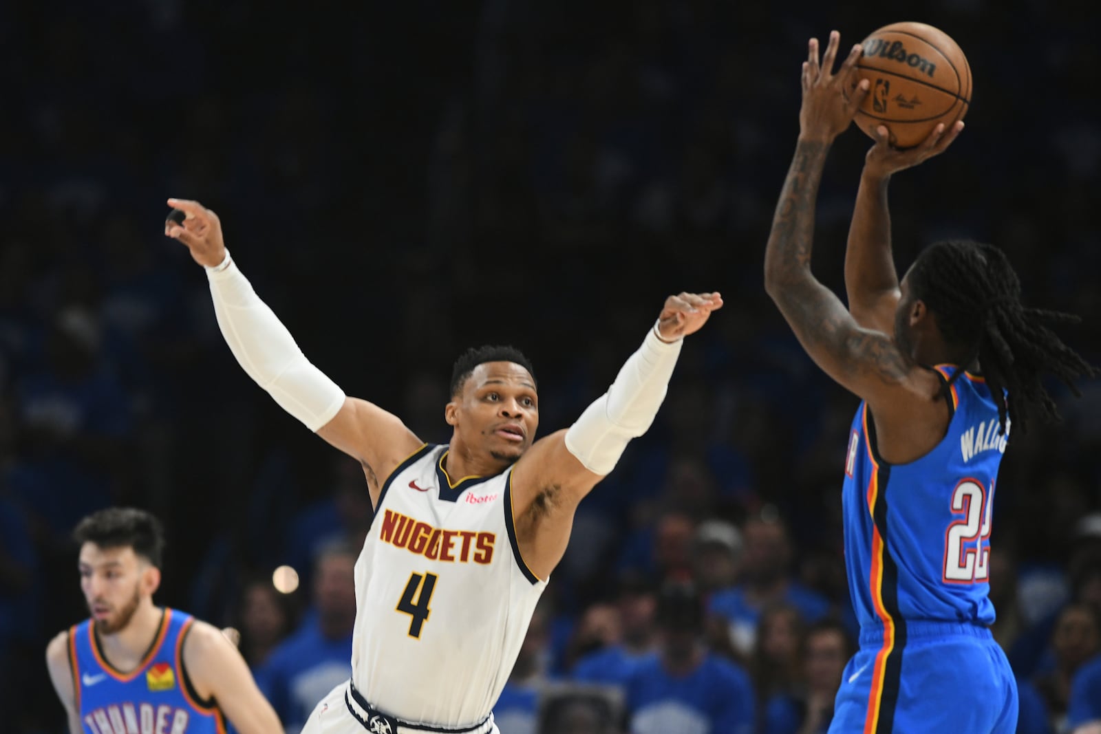Denver Nuggets guard Russell Westbrook (4) defends against a shot by Oklahoma City Thunder's Cason Wallace (22) in the first half of Game 7 in the Western Conference semifinals of the NBA basketball playoffs, Sunday, May 18, 2025, in Oklahoma City. (AP Photo/Kyle Phillips)